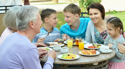 Happy family at breakfast