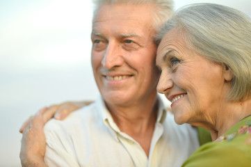 Senior couple on  sky background