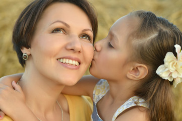 Mother and daughter on nature