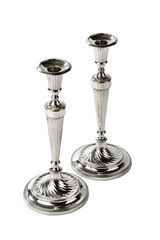 Pair of ornate antique silver single candlesticks