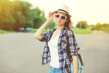 Portrait of beautiful woman wearing a sunglasses, checkered shir