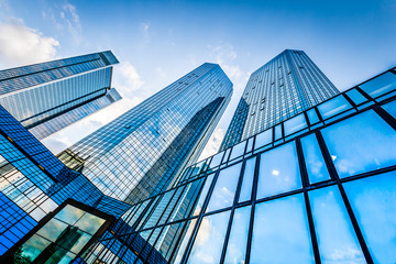 Modern skyscrapers in business district with blue sky - obrazy, fototapety, plakaty