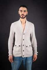 Handsome man doing different expressions in different sets of clothes: posing