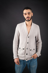 Handsome man doing different expressions in different sets of clothes: sad