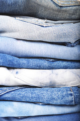 Stack of denim jeans