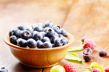 Wooden bowl of organic blueberries