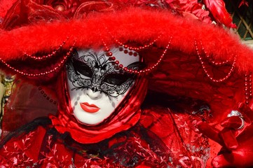 Woman in red at the Carnival of Venice, Italy