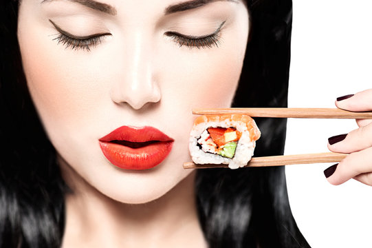 Fashion Art Portrait Of Beauty Model Girl Eating Sushi Roll