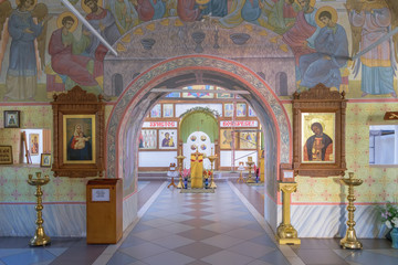 Fototapeta na wymiar Archway to iconostasis through halls of worship in church