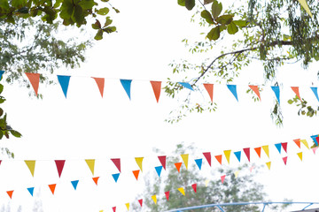colorful triangular flags of decorated celebrate outdoor party