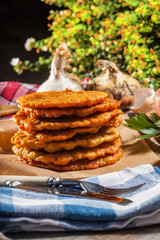Potato pancake on a wooden table.
