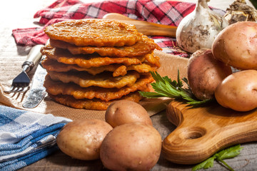 Potato pancake on a wooden table.