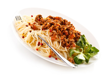 Pasta with meat, tomato sauce and vegetables on white background
