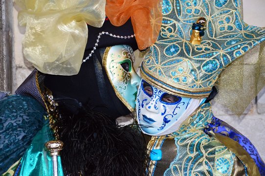 Two masks whispering during the Carnival of Venice in Italy