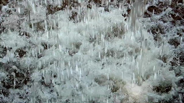 water falling into a puddle