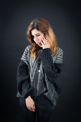 Fototapeta premium Beautiful woman doing different expressions in different sets of clothes: sad