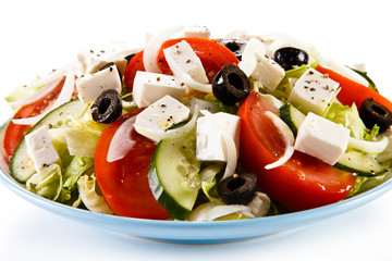 Greek salad on white background