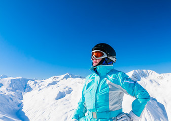 Fototapeta na wymiar Portrait skier mountains in the background. Ski resort Livigno.