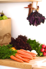 Young woman cutting vegetables in the kitchen