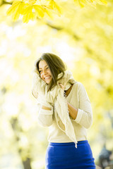 Young woman in autumn forest