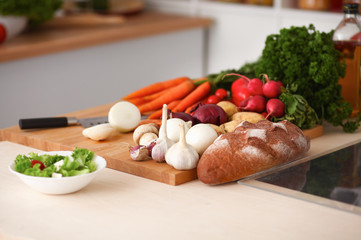 Grocery shopping bag with vegetables on kitchen