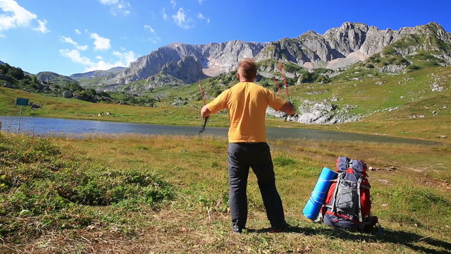 tourist man in mountain with backpack