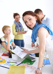 Fototapeta premium Portrait of attractive female designer in office