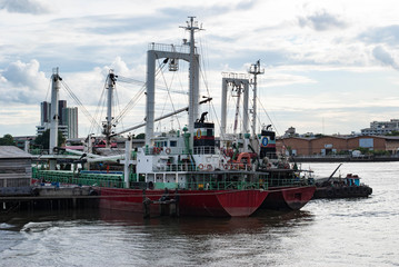 Fototapeta premium Cargo Ship docked in Chao Phraya River, Bangkok, Thailand