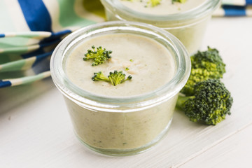 Broccoli cream soup on table