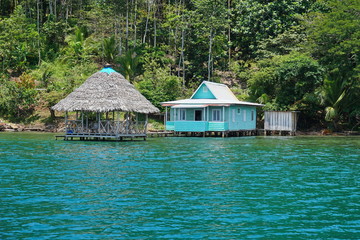 Typical house with thatched hut over water Panama