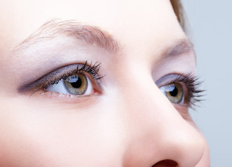 Fototapeta premium Close-up of female face with eyes makeup