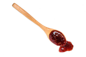 Wooden spoon with raspberry jam