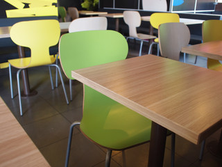 Wooden tables and chairs in a fastfood