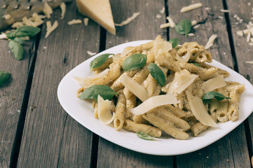 Italian pasta on the wooden table,