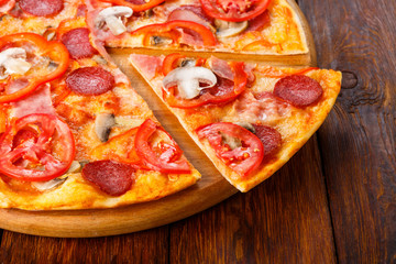 Delicious pizza with mushrooms, chili and pepperoni