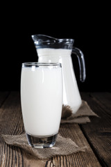 Milk on a dark wooden background