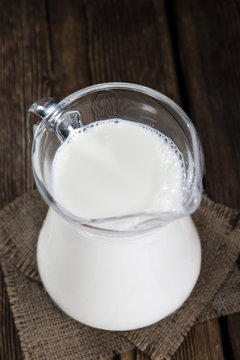 Milk on a dark wooden background