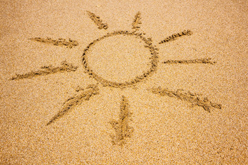 Sun drawing in the sand