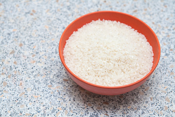 uncooked rice in a cup on the table