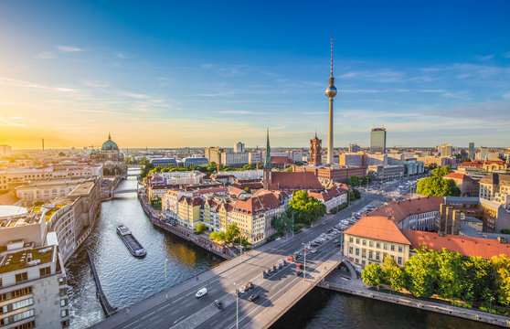 Berlin skyline panorama with TV tower and Spree river at sunset, Germany