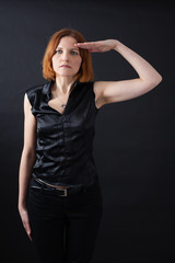 Beautiful woman doing different expressions in different sets of clothes: at attention