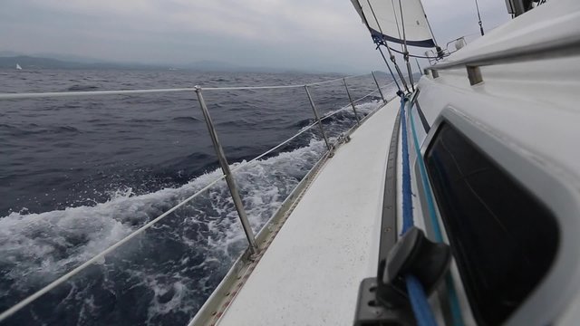 Sailing. Racing yacht in the Mediterranean sea. Luxury Lifestyle. Luxury yachts. Boat in sailing regatta. Sailing yacht on the race in a stormy sea.