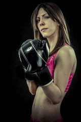 Beautiful athlete woman with boxing gloves