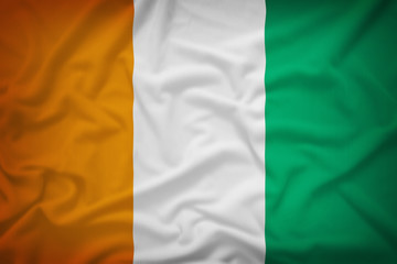 Cote dIvoire flag on the fabric texture background,Vintage style