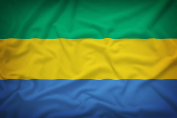 Obraz premium Gabon flag on the fabric texture background,Vintage style