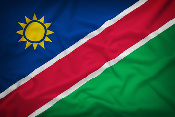 Namibia flag on the fabric texture background,Vintage style