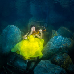 The girl with a violin under water