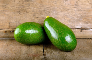 Avocado fruit on the wooden background