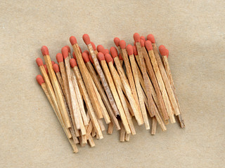 Match on brown paper background