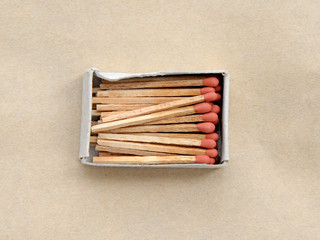 box of matches on brown background
